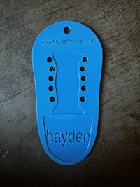 a blue shoe tag with the word hayden on it