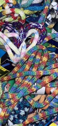 a bunch of colorful ropes laying on top of each other